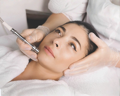 Provider applying AriEssence PDGF+ serum during a facial in Los Angeles 90045